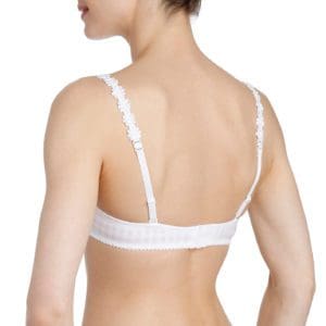 Woman's Back wearing a cream bra with pearl patterned straps