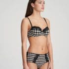Woman wearing Marie Jo Ely Padded Balconnet Bra In Black and White with matching briefs
