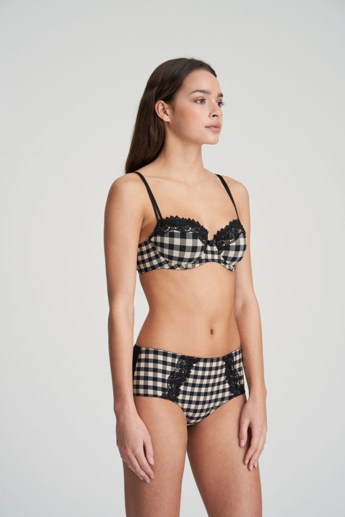 Woman wearing Marie Jo Ely Padded Balconnet Bra In Black and White with matching briefs