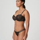 Brunette woman wearing the Prima Donna Aprodisia Twist Collection Lingerie